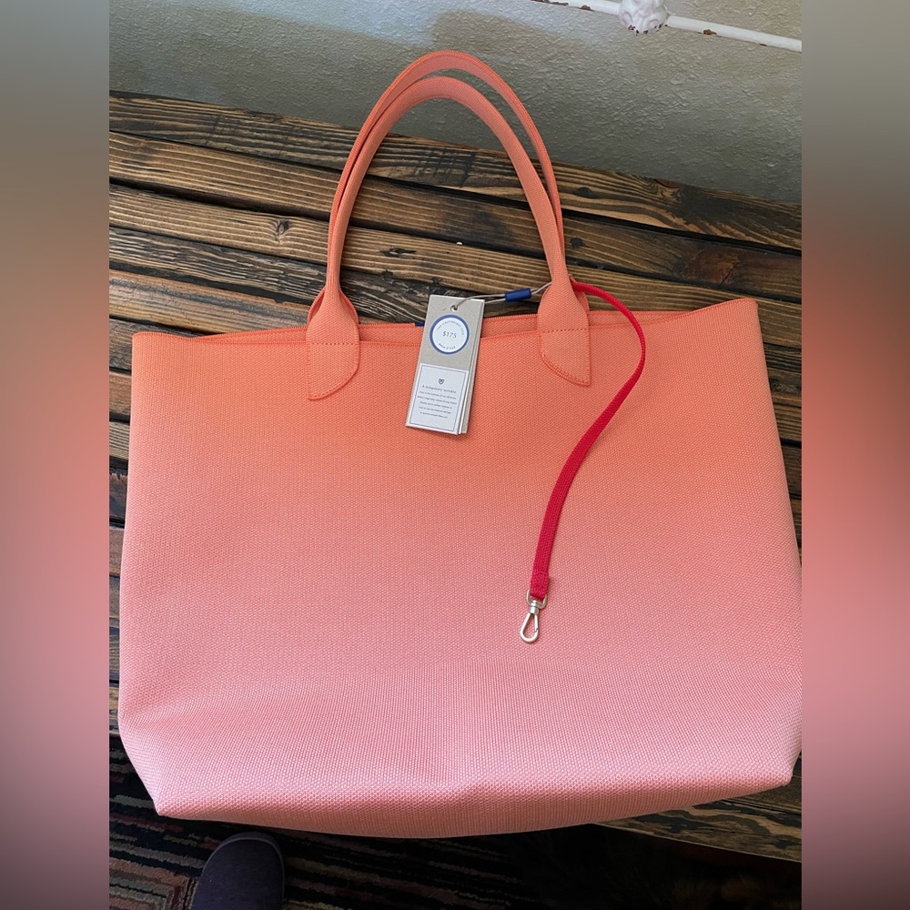 New Rothy’s bag with tags. Beautiful orange cream color.